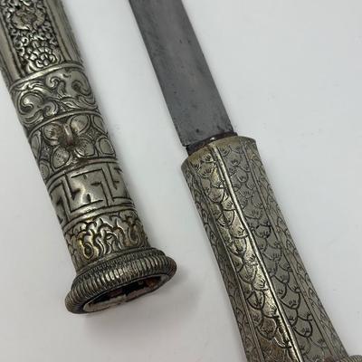 Sale Photo Thumbnail #160: 16” overall length
Antique 19th century intricately engraved dagger & scabbard of Tibetan or Bhutanese origin.