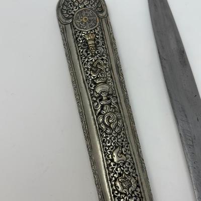 Sale Photo Thumbnail #159: 16” overall length
Antique 19th century intricately engraved dagger & scabbard of Tibetan or Bhutanese origin.