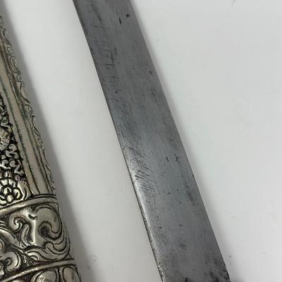 Sale Photo Thumbnail #158: 16” overall length
Antique 19th century intricately engraved dagger & scabbard of Tibetan or Bhutanese origin.
