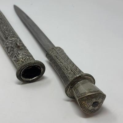 Sale Photo Thumbnail #161: 16” overall length
Antique 19th century intricately engraved dagger & scabbard of Tibetan or Bhutanese origin.