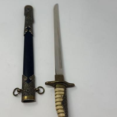 Sale Photo Thumbnail #191: Replica WWII. Made of metal. Non-sharp blade