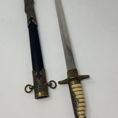 Sale Photo Thumbnail #186: Replica WWII. Made of metal. Non-sharp blade
