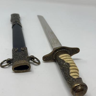 Sale Photo Thumbnail #190: Replica WWII. Made of metal. Non-sharp blade
