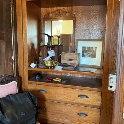 Sale Photo Thumbnail #328: On display at the ReStore Bottom cube
Original cost 14000
This piece is large and beautiful. An antique from England it was commissioned to be redesigned with interior drawers. 
It took 6 men to bring in. You will need to provide a crew to remove. 
Conten