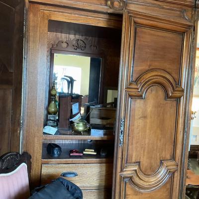 Sale Photo Thumbnail #327: On display at the ReStore Bottom cube
Original cost 14000
This piece is large and beautiful. An antique from England it was commissioned to be redesigned with interior drawers. 
It took 6 men to bring in. You will need to provide a crew to remove. 
Conten
