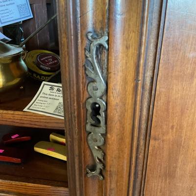 Sale Photo Thumbnail #331: On display at the ReStore Bottom cube
Original cost 14000
This piece is large and beautiful. An antique from England it was commissioned to be redesigned with interior drawers. 
It took 6 men to bring in. You will need to provide a crew to remove. 
Conten