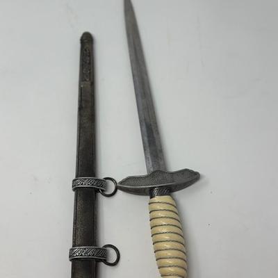 Sale Photo Thumbnail #202: Size: 15 1/4”
WWII 2nd Pattern German Luftwaffe bayonet with maker's mark on dagger 'Original Eickhorn Solingen.' Both scabbard and dagger have etched oak leaves and acorns adorning it. An eagle and two swastikas are depicted on the hilt.