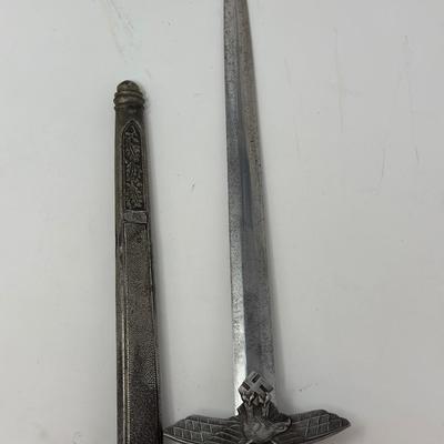 Sale Photo Thumbnail #201: Size: 15 1/4”
WWII 2nd Pattern German Luftwaffe bayonet with maker's mark on dagger 'Original Eickhorn Solingen.' Both scabbard and dagger have etched oak leaves and acorns adorning it. An eagle and two swastikas are depicted on the hilt.