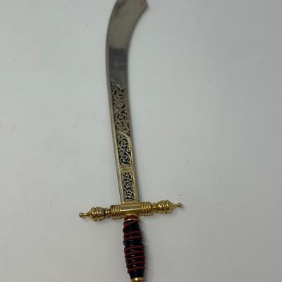 Sale Photo Thumbnail #209: Made in Spain
Size: 13 3/4”
Toledo Steel ornate sword shaped letter opener