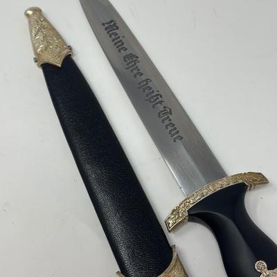 Sale Photo Thumbnail #214: Size: 14 2/2”
WWII German model SS honor dagger with the motto 'Meine Ehre Heisst Treue' etched on one side of the stainless-steel blade meaning 'Loyalty is my honor.' Etched on the reverse side of the dagger is 'In Herzlicher  Kameradschaft H. Himmler'