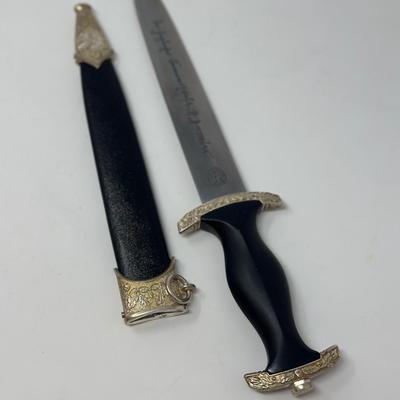 Sale Photo Thumbnail #216: Size: 14 2/2”
WWII German model SS honor dagger with the motto 'Meine Ehre Heisst Treue' etched on one side of the stainless-steel blade meaning 'Loyalty is my honor.' Etched on the reverse side of the dagger is 'In Herzlicher  Kameradschaft H. Himmler'