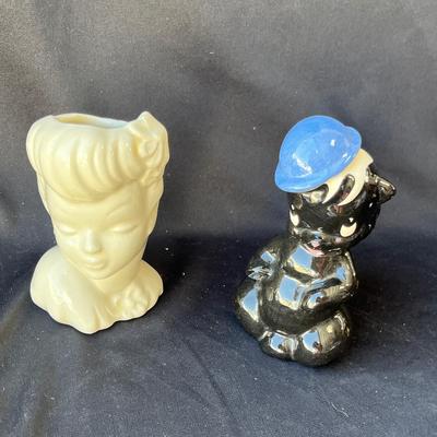 Sale Photo Thumbnail #1096: Head vase and lil stinker vase.