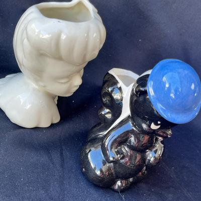 Sale Photo Thumbnail #1099: Head vase and lil stinker vase.
