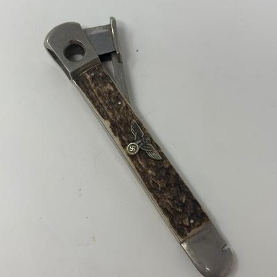Sale Photo Thumbnail #248: 5 3/4”
Stainless steel with imitation wood handle and Reichsadler with swastika overlay. NSDAP is a German abbreviation for the Nazi Party.