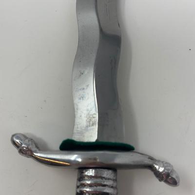 Sale Photo Thumbnail #263: 10 1/2”
Circa 1940-60's Kris Dagger made by G.C. Co. Solingen Germany. It has a full S shaped aluminum guard with a cast aluminum lion head pommel.