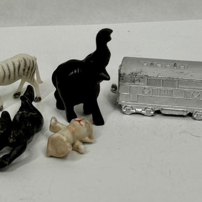 Sale Photo Thumbnail #400: Includes a zebra, elephant, chrome train engine, cat and