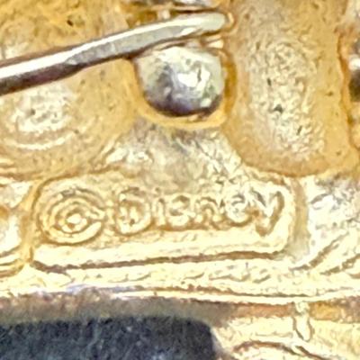 Sale Photo Thumbnail #461: This is a brooch/pin has Pooh climbing a ladder to reach a pot of honey. .It measures 1 inches  high x 2.5 inches wide. Very good condition.