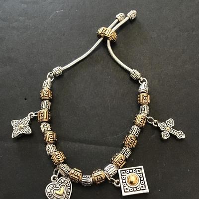 Very nice silver and gold toned slider Charm bracelet