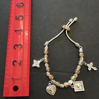 Very nice silver and gold toned slider Charm bracelet