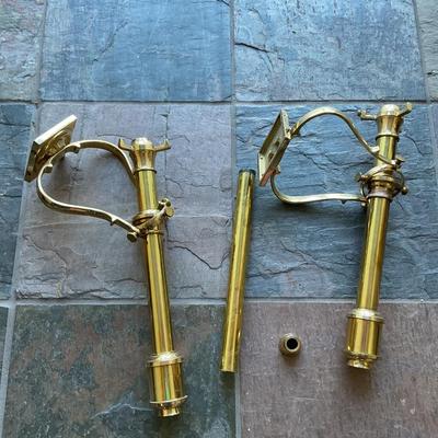 a pair of brass wall candle sconces. These are decorative