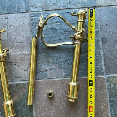 a pair of brass wall candle sconces. These are decorative