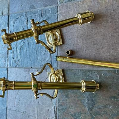 a pair of brass wall candle sconces. These are decorative