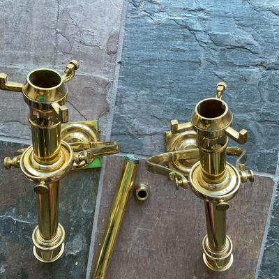 a pair of brass wall candle sconces. These are decorative