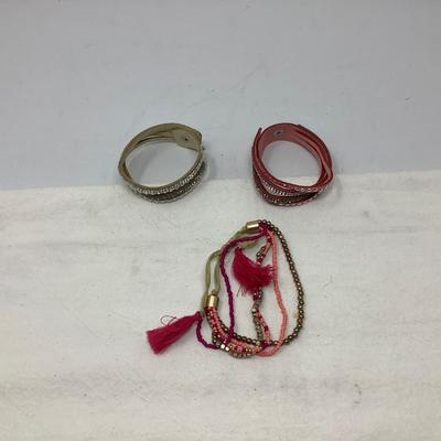 Sale Photo Thumbnail #228: You get two leather with snaps and rhinestones and another cloth and beads.