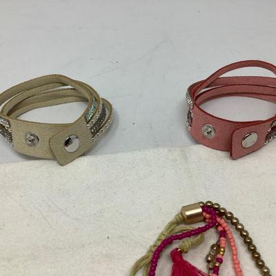 Sale Photo Thumbnail #230: You get two leather with snaps and rhinestones and another cloth and beads.