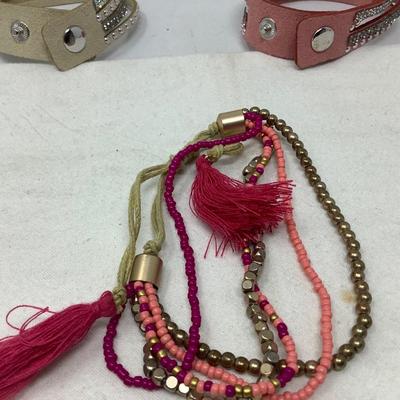 Sale Photo Thumbnail #231: You get two leather with snaps and rhinestones and another cloth and beads.