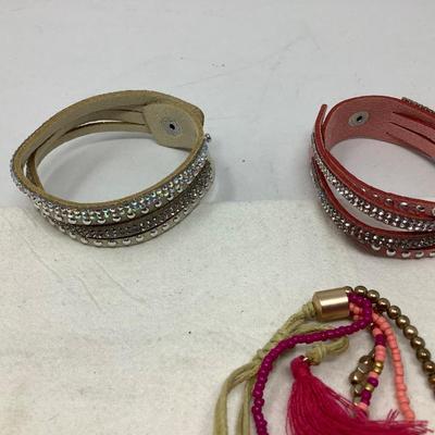 Sale Photo Thumbnail #229: You get two leather with snaps and rhinestones and another cloth and beads.