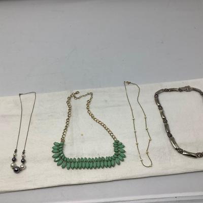 Sale Photo Thumbnail #236: Beaded necklace, green plastic and metal choker, gold with white beads necklace and modern metal choker.