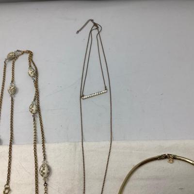 Sale Photo Thumbnail #243: You get the nice gold choker, the gold with dual gem pendants,  gold with egg necklace.