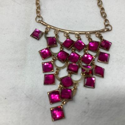 Sale Photo Thumbnail #249: You get three great gold necklaces.  Two have plastic flower pendants and the third has purple plastic gems.