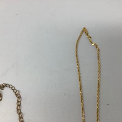Sale Photo Thumbnail #252: You get three great gold necklaces.  Two have plastic flower pendants and the third has purple plastic gems.