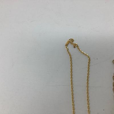 Sale Photo Thumbnail #248: You get three great gold necklaces.  Two have plastic flower pendants and the third has purple plastic gems.