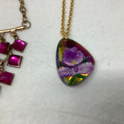 Sale Photo Thumbnail #251: You get three great gold necklaces.  Two have plastic flower pendants and the third has purple plastic gems.