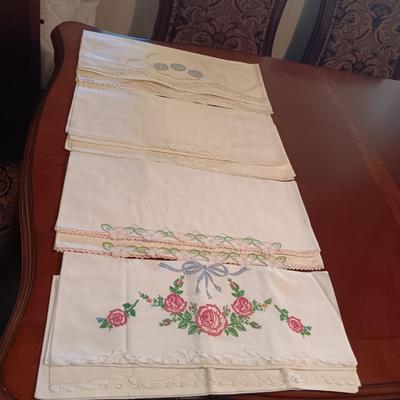 FOUR SETS (8) OF CRAFTED PILLOWCASES