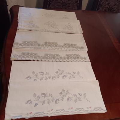 THREE SETS OF HANDCRAFTED PILLOWCASES