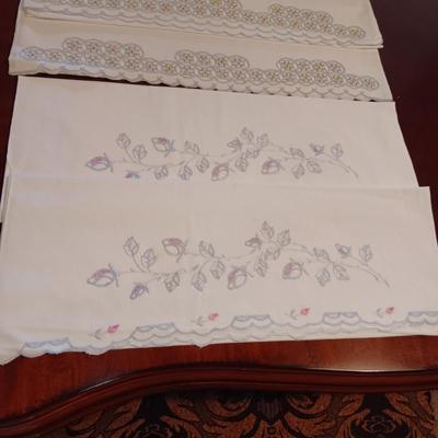THREE SETS OF HANDCRAFTED PILLOWCASES