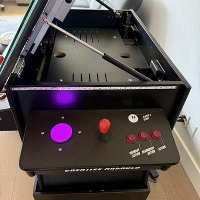 Sale Photo Thumbnail #26: The Creative Arcade Home Console offers Wi-Fi capability and displays in 720p HD resolution. It features a multicolor design and is manufactured in the United States. This pre-owned console is suitable for casual gaming sessions at home.