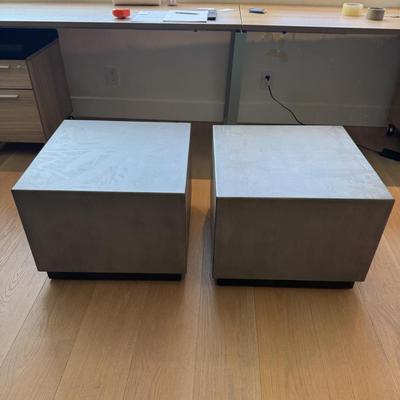 Sale Photo Thumbnail #32: This Pottery Barn coffee table from the Modern Concrete Collection is designed for both indoor and outdoor use. Crafted in the USA, it features a modern square shape with dimensions of 18 inches in height, 24 inches in length, and 24 inches in width. Made