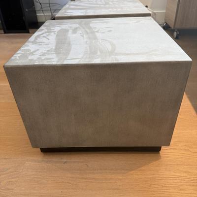 Sale Photo Thumbnail #34: This Pottery Barn coffee table from the Modern Concrete Collection is designed for both indoor and outdoor use. Crafted in the USA, it features a modern square shape with dimensions of 18 inches in height, 24 inches in length, and 24 inches in width. Made