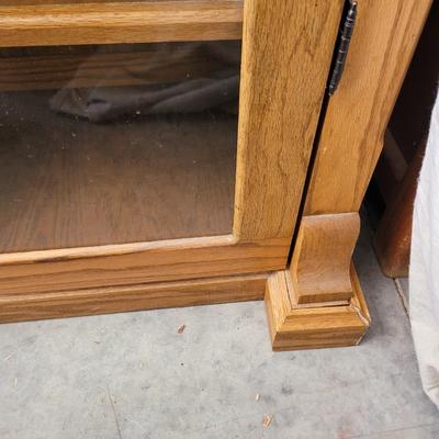 Sale Photo Thumbnail #861: Measures 48" wide, 19" deep and 57" tall. 4 shelves and two drawers, wrapped for storage and only slightly unwrapped for photos, will wrap further for transport. Oak
Doors are 21.5" wide and about 47" tall.