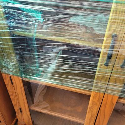 Sale Photo Thumbnail #860: Measures 48" wide, 19" deep and 57" tall. 4 shelves and two drawers, wrapped for storage and only slightly unwrapped for photos, will wrap further for transport. Oak
Doors are 21.5" wide and about 47" tall.