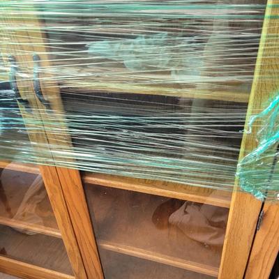 Sale Photo Thumbnail #859: Measures 48" wide, 19" deep and 57" tall. 4 shelves and two drawers, wrapped for storage and only slightly unwrapped for photos, will wrap further for transport. Oak
Doors are 21.5" wide and about 47" tall.