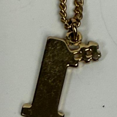 Sale Photo Thumbnail #279: Shiny gold-tone #1 pendant with 18" chain. Good condition.