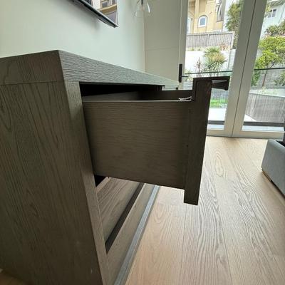 Sale Photo Thumbnail #36: The Restoration Hardware dresser from the Bezier Collection is a contemporary piece designed for the bedroom. It features a high gloss gray oak finish and is constructed from oak, offering a sleek and modern look. The dresser measures 6 feet in length, 22