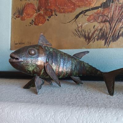 2 METAL FISH THAT ARE HINGED TO GIVE THE APPEARANCE OF MOVING