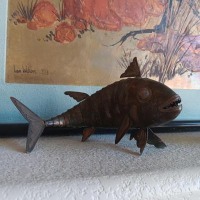2 METAL FISH THAT ARE HINGED TO GIVE THE APPEARANCE OF MOVING